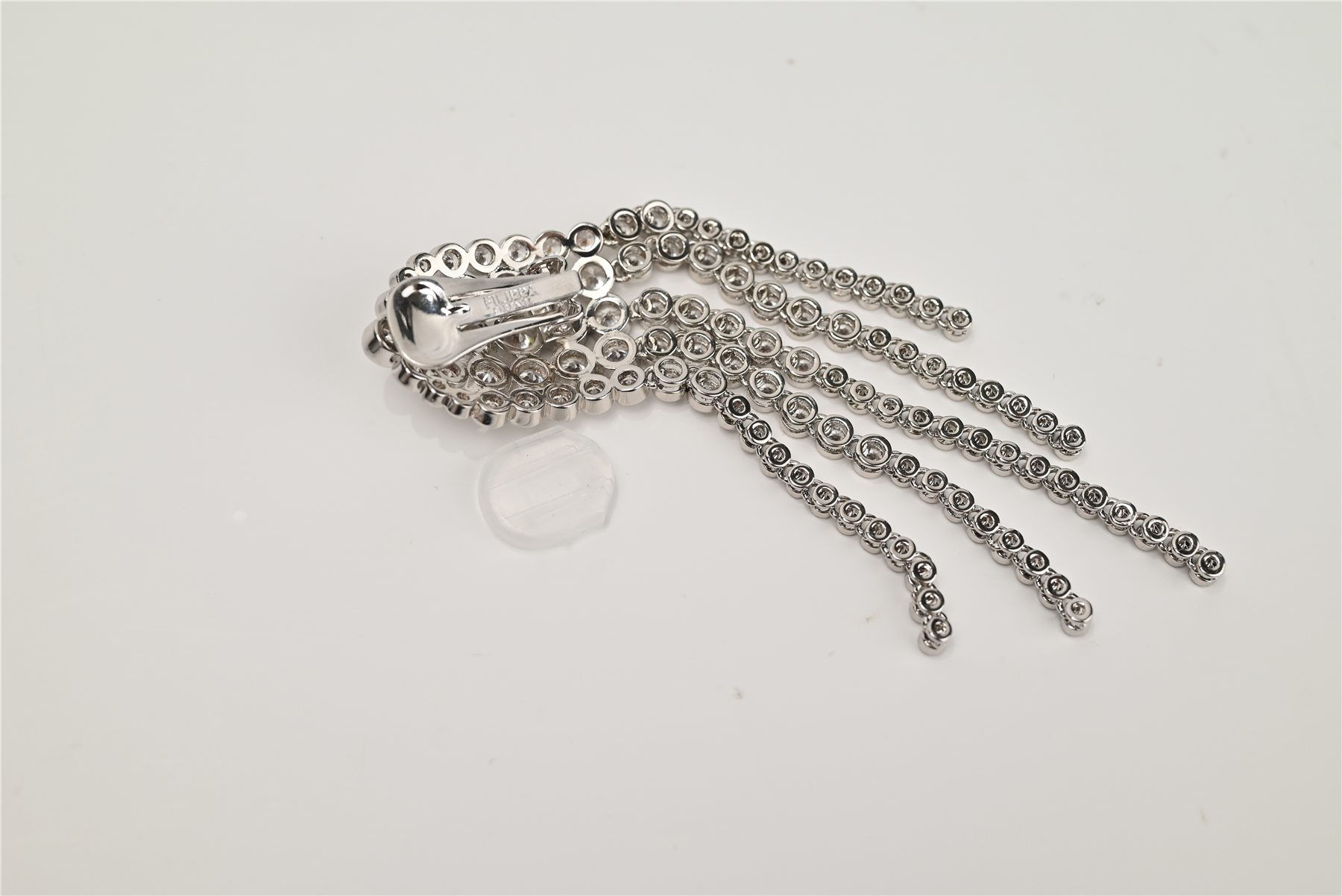 Rear view of a finished crystal fringe clip earring